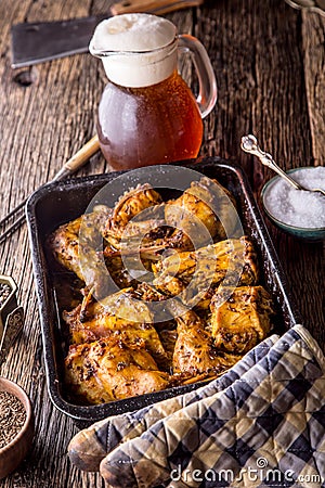 Rabbit. Roasted rabbit slices with american potatoes garlic spices salt,pepper cumin and draft beer. Hunting cuisine Stock Photo