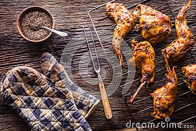 Rabbit. Roasted rabbit slices with american potatoes garlic spices salt,pepper cumin and draft beer. Hunting cuisine Stock Photo
