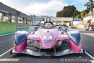 Race car driver standing on starting grid looking at camera front view Editorial Stock Photo