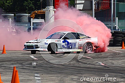 Race car power drift and burnout with purple smoke Editorial Stock Photo