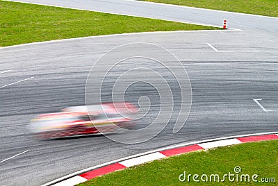 Race track with a blurred sport car Stock Photo
