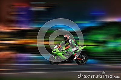 Racing bike rider racing at high speed Stock Photo