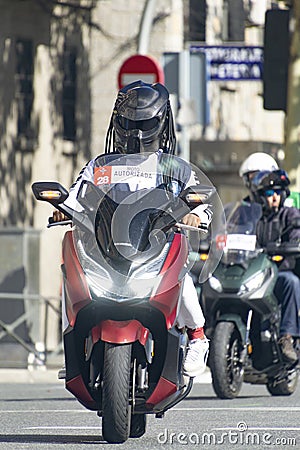 Racing car that opens the way to the runners of the half marathon that passes through the central streets of Madrid, in Spain. Editorial Stock Photo