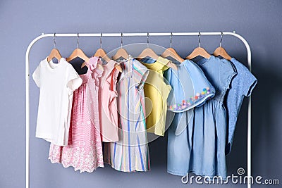 Rack with stylish child clothes Stock Photo