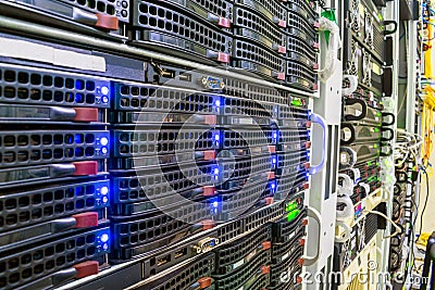 Racks with computer server devices. Hosted services are in the datacenter room. Cloud storage technologies. Information center Stock Photo