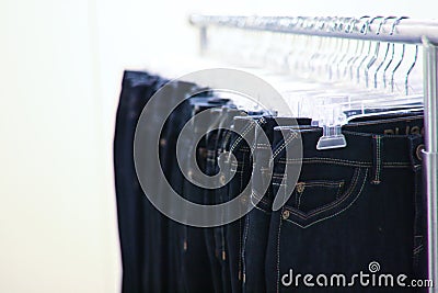 Racks of Jeans hanging in a store Stock Photo
