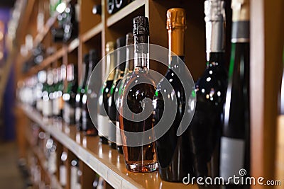 Racks with red and white wine bottles in store Stock Photo