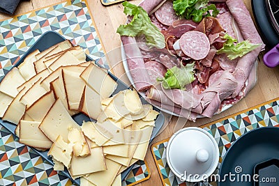 Raclette cheese and meat, french tradition Stock Photo