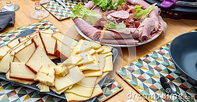 Raclette cheese and meat, french tradition Stock Photo