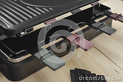 Raclette machine with trays Stock Photo