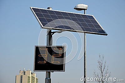 Radar to measure the speed of vehicles in the city. A reflective green sign on a pole with LED light numbers informs car drivers h Stock Photo