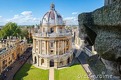 The Radcliffe Camera and a gargoyle from the Church of St Mary at Oxford Editorial Stock Photo