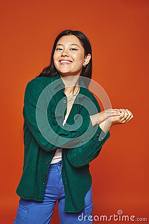 radiant young asian woman posing in Stock Photo