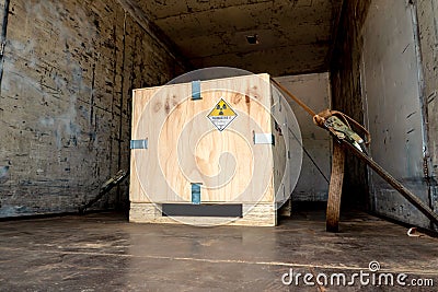 Radiation label beside the transport wooden box Type A package in the truck Stock Photo