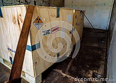 Radiation label beside the transport wooden box Type A package in the truck Stock Photo