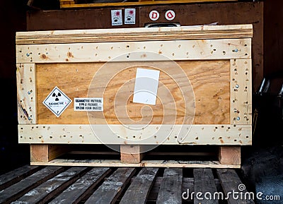 Radiation warning sign transport label Class 7 on the Dangerous goods package type A in the container of transport truck Stock Photo