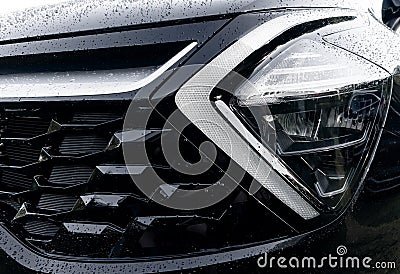 Radiator grille pattern. Car radiator grill close up with water drops. Chrome grill of big powerful car engine. Car exterior Stock Photo