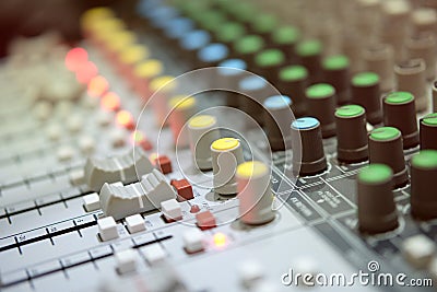 Radio analog mixer in broadcast room with blur backgound Stock Photo