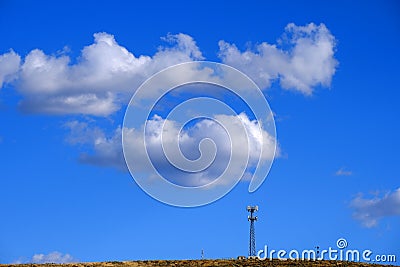 Radio Tower Telecommunications Blue Sky and Clouds Stock Photo