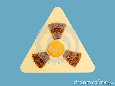 Radioactive radiation danger symbol with yellow and black stripes made from food, unsafe food Stock Photo