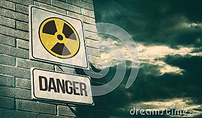 Radioactivity and chemical hazard street sign with toxic clouds Stock Photo