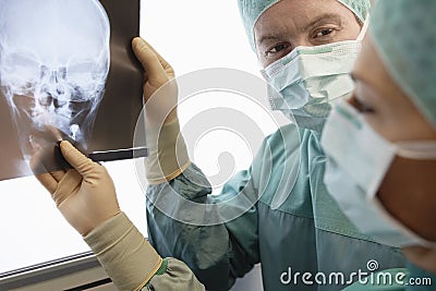 Radiologists Examining Xray Of Skull Stock Photo