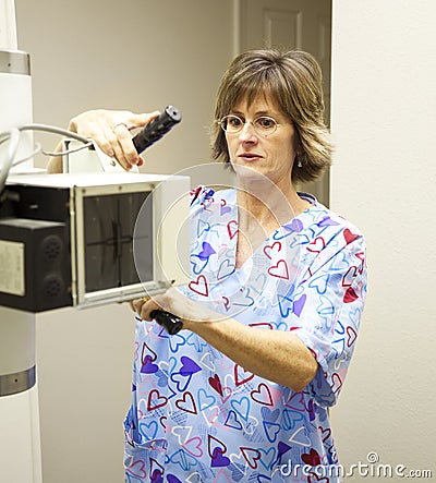 Radiology Technician with X-Ray Stock Photo