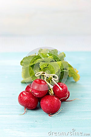 Radishes on blue board Stock Photo