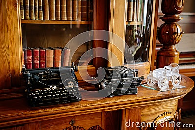 Radun castle interior, Neo-Classical chateau, library and bookshelves, typewriter, baroque and rococo carved wooden furniture, Editorial Stock Photo