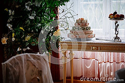 Radun castle interior, Neo-Classical chateau, red tea salon, baroque and rococo white furniture, table set for tea, sweets and Editorial Stock Photo