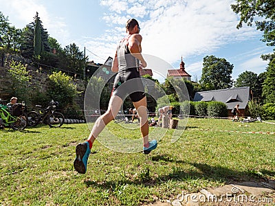 Triathlon depot after swimming, mountain bike continues Editorial Stock Photo