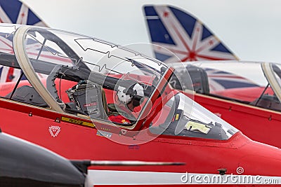 Royal Air Force Pilot in the cockpit of a Red Arrows British Aerospace Hawk T.1 jet trainer aircraft. Editorial Stock Photo