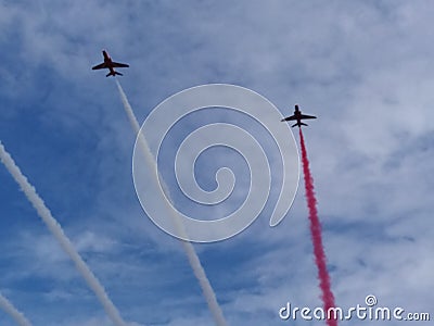 RAF Red Arrows in action with coloured smoke Stock Photo