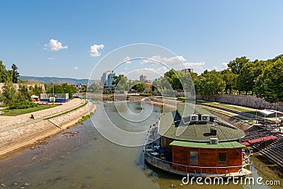 Raft restaurant on river Nisava and a quay promenade park Editorial Stock Photo