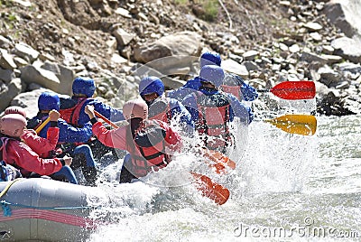Rafting team splashing Stock Photo