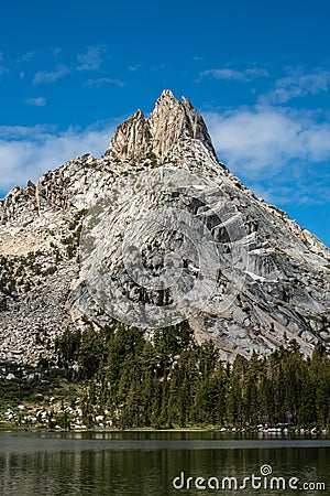 Ragged Peak Towers over Young Lakes Stock Photo