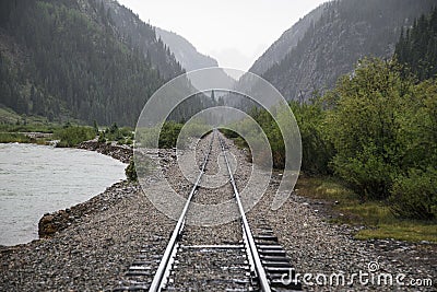 Raid Road tracks towards mountains and Animas River, Durango and Silverton Narrow Gauge Railroad, Silverton, Colorado, USA Stock Photo