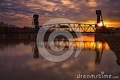 Rail Bridge with a early morning colorful sunrise, Hastings, Minnesota Stock Photo