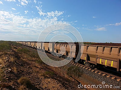 Rail carriages filled with Iron ore Western Australia Stock Photo