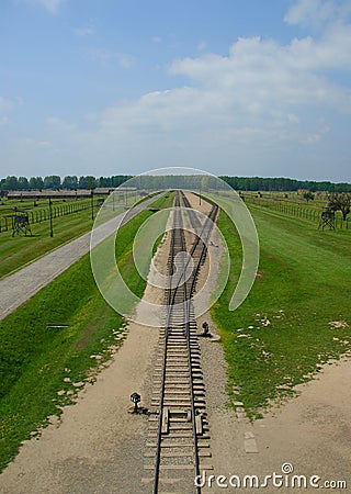 Rail entrance to concentration camp at Auschwitz II - Birkenau. Editorial Stock Photo