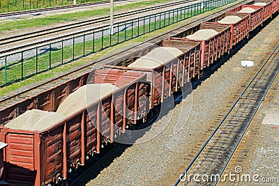 Rail freight wagons with sand Stock Photo