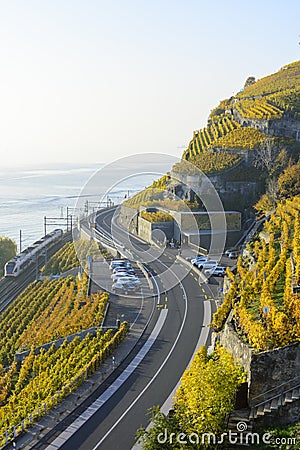 Rail and Road through postcard landscape Stock Photo