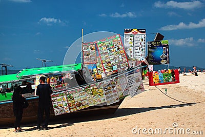 Fast food vendors on long-tailed boats at Phra Nang beach in Krabi province, Thailand Editorial Stock Photo