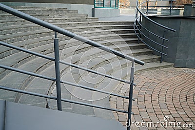 Railings at the marble semicircular steps in the building Stock Photo