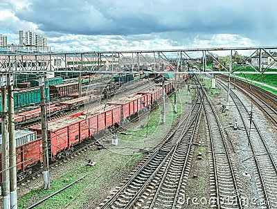 Railroad in the city. metal rails. on the road are freight, freight wagons of red color, large and capacious wagons for the Stock Photo