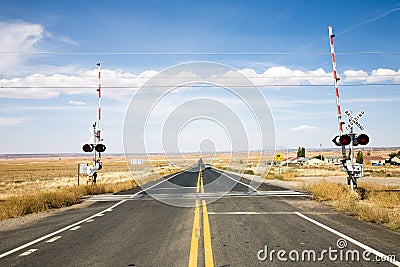 Railroad crossing with gates Stock Photo