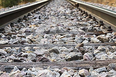 Railroad detail with Rails, Sleepers and Paving Stones Stock Photo