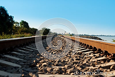 Railroad going to the distance near the shore Stock Photo