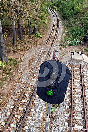 Railroad and semaphore with green signal Stock Photo