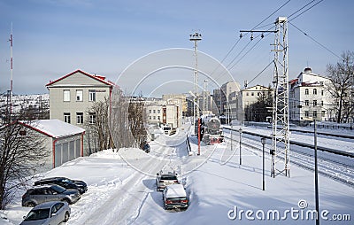 Railroad station. An old steam locomotive on a siding. City of Murmansk. Editorial Stock Photo